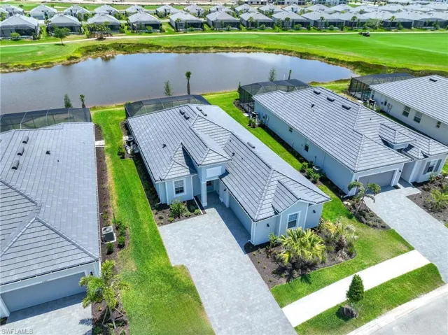 Aerial view with a water view and a residential view