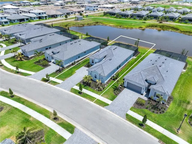 Aerial view featuring a residential view and a water view