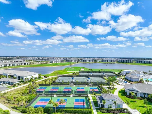 Drone / aerial view featuring a water view and view of golf course