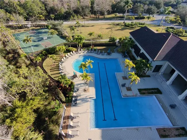 Community pool with a patio