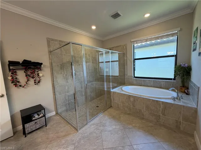 Master Bathroom with a bath, a shower stall, crown molding, tile patterned floors, and recessed lighting