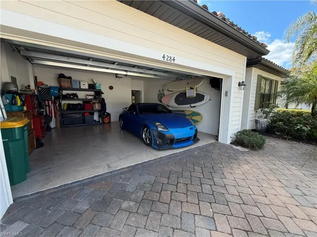 Garage featuring driveway