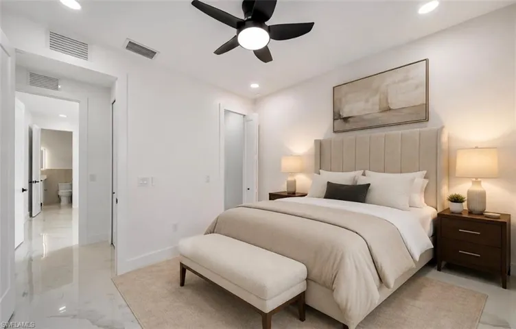 Recessed lighting, ceiling fan, white walls, and light-toned flooring