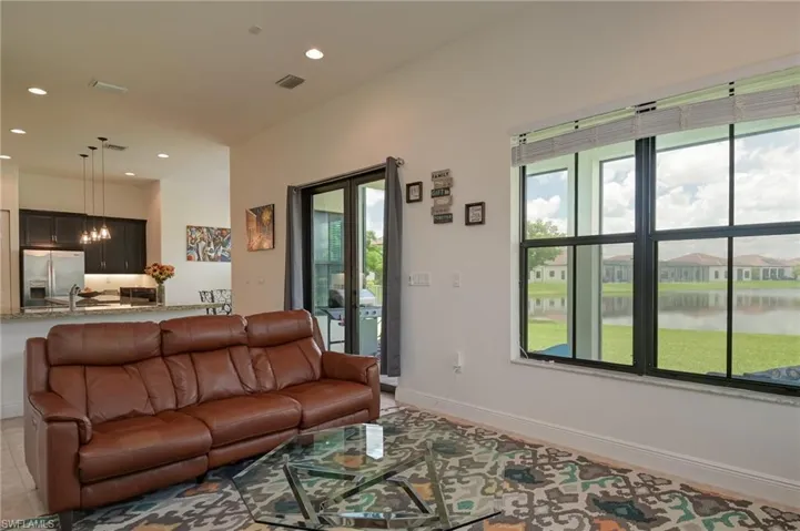 Family room with view of lanai and lake