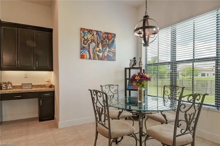 Breakfast nook and built-in desk seen from the kitchen