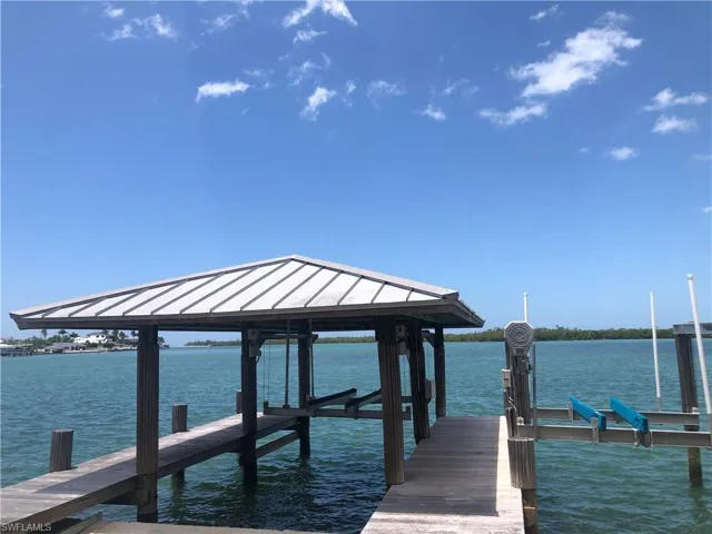 Boat House with lift and a secondary  lift to the north side for a flarger vessel. Both walkways were rebuilt with ipe wood.