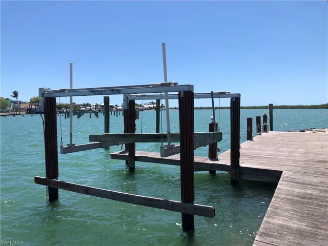 Room to moor a yacht and an extra boat lift with a beautiful ipe wood boardwalk.