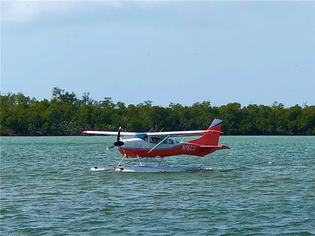 Pilots come by Seaplane to go to the local Osteria Capri restaurant.   Or, simply take a 30 second walk to the restaurant from this home at 410 Cristobal Street.