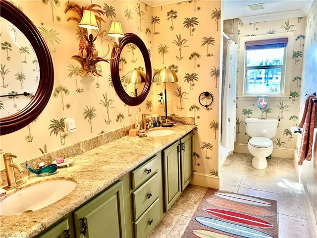 Primary bathroom closest to the swimming pool with private entry/exit out to the swimming pool/waterfall.