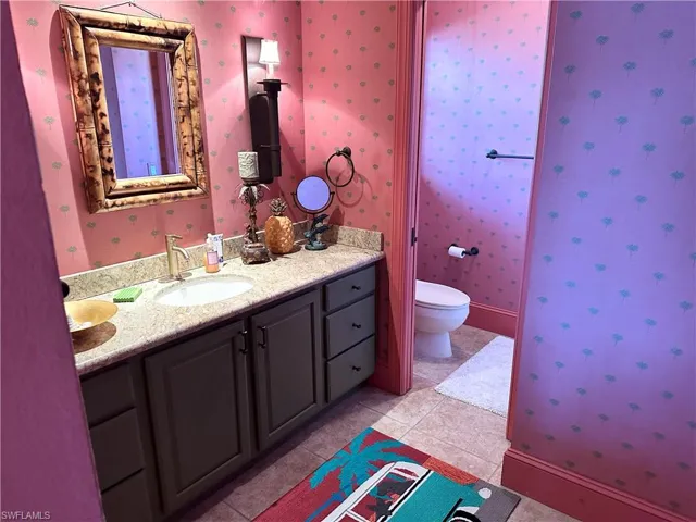 This particular primary ensuite has a very large walk-in closet that runs deep.