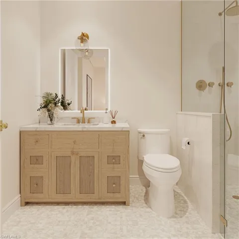 Bathroom with a tile shower and vanity