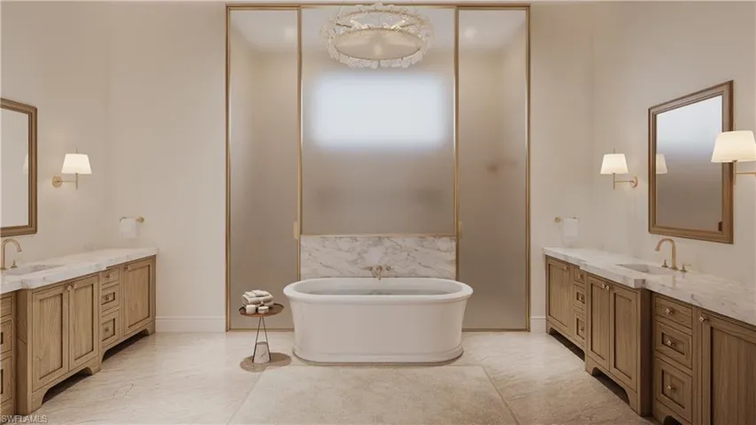 Bathroom with two vanities and a freestanding bath