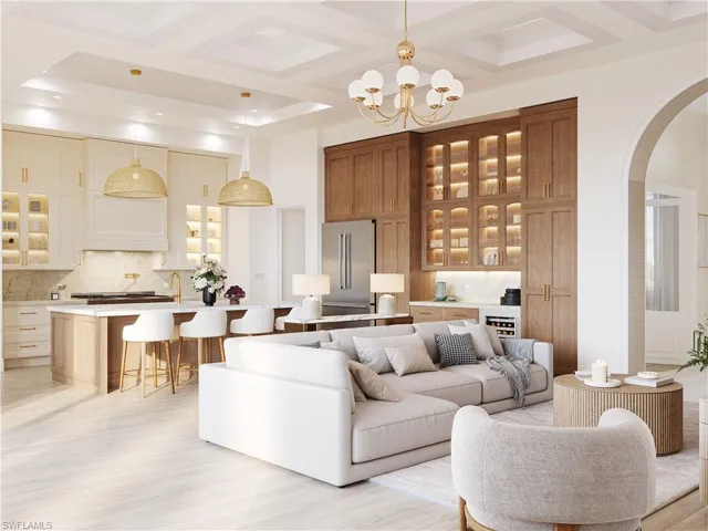 Living area featuring coffered ceiling, arched walkways, light wood finished floors, suspended lighting, and beverage cooler