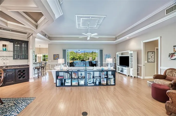 Living room with ornamental molding,  and luxury vinyl  flooring