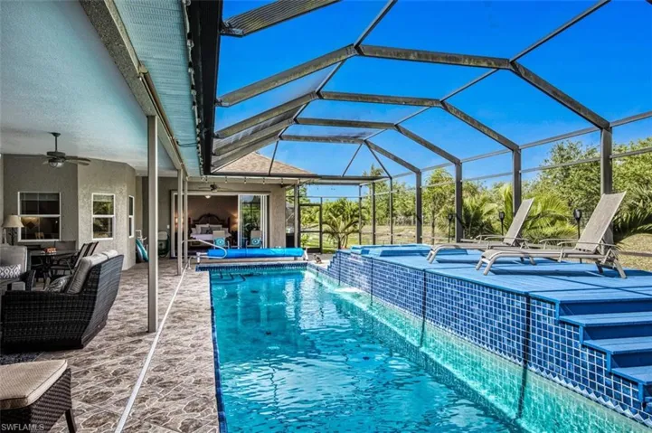 Outdoor pool and spa featuring a patio, an outdoor hangout area, and plenty of room to entertain your friends and family.