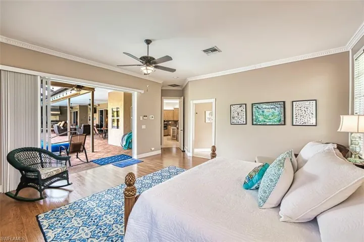 Primary bedroom with view of pool.