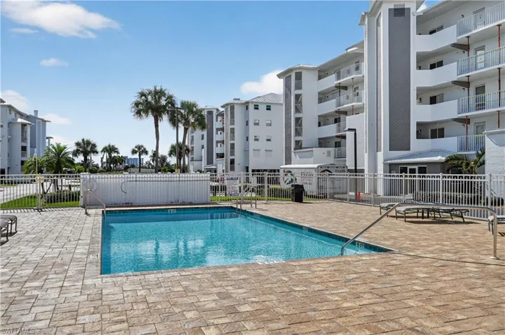 Community pool featuring a patio