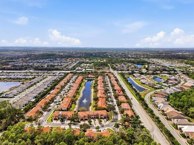 Aerial perspective of suburban area with a large body of water