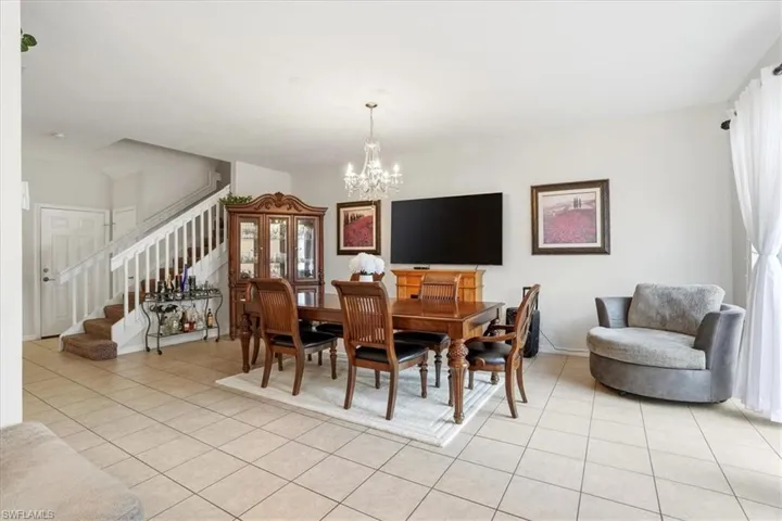 Dining space featuring a chandelier and light tile patterned floors