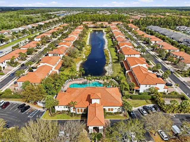 Aerial overview of property's location featuring nearby suburban area and a nearby body of water
