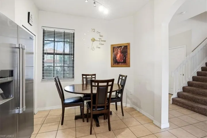 Dining area featuring light tile patterned flooring
