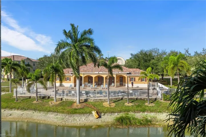 View of property's community with a water view, a swimming pool, and a patio area