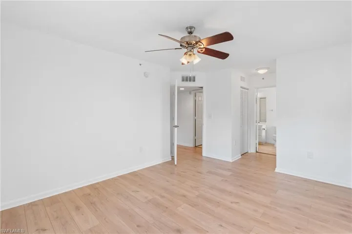 Empty room featuring ceiling fan and light wood-type flooring
