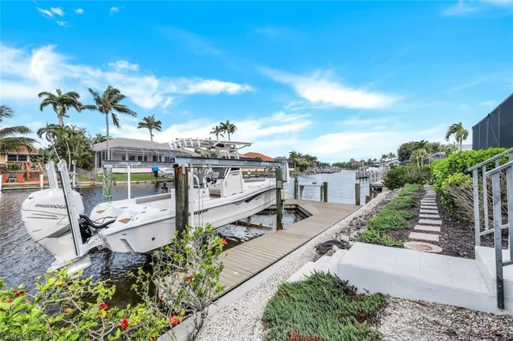 Dock area featuring a water view