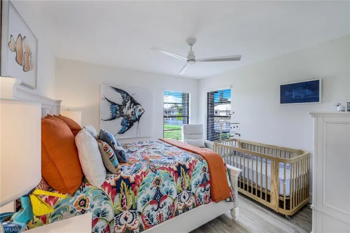 Bedroom featuring ceiling fan and hardwood / wood-style floors