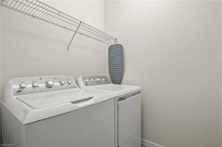 Laundry room with washer and dryer included.