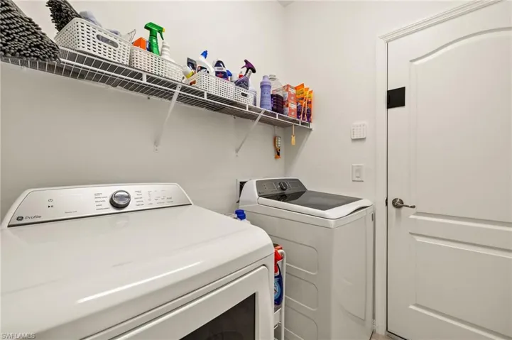 Laundry room with laundry area and washing machine and clothes dryer