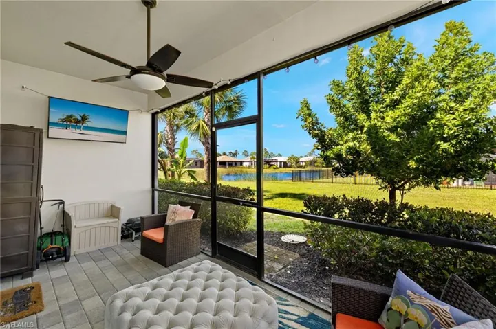 Sunroom featuring a ceiling fan