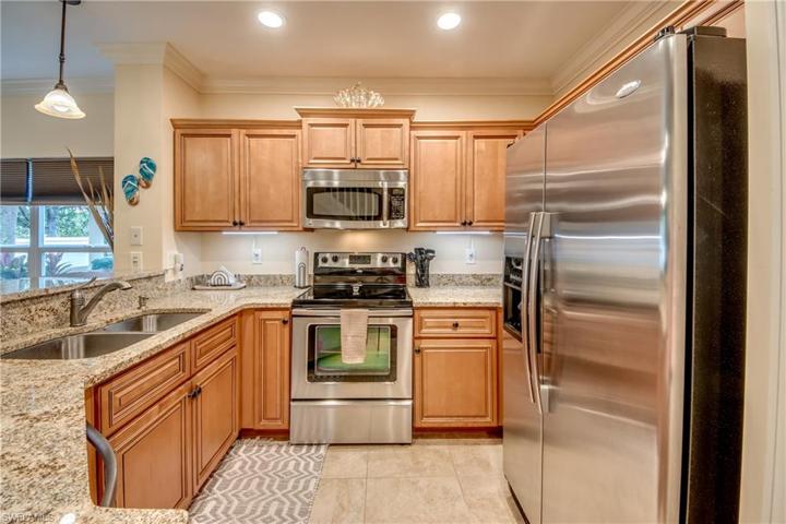 Beautiful solid maple wood cabinets, granite countertops & newer stainless appliances