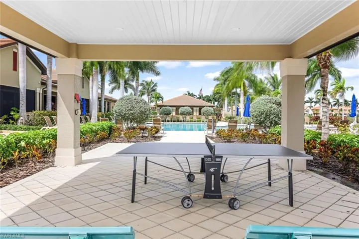 View of patio with a community pool