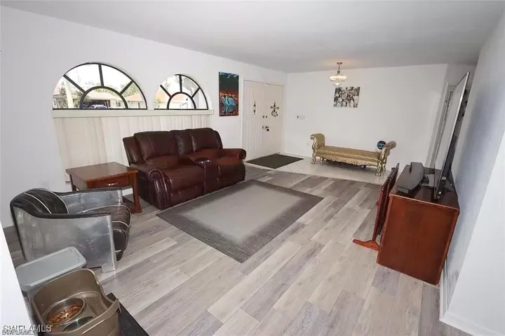 Living room with light wood-type flooring