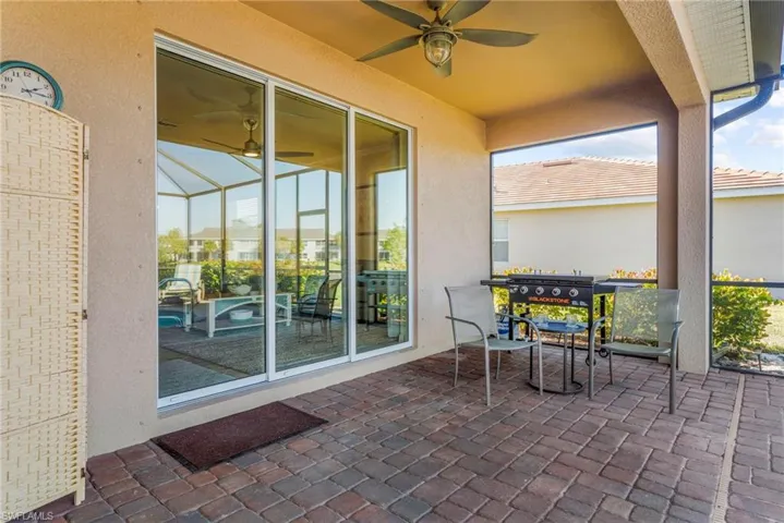 View of patio featuring ceiling fan