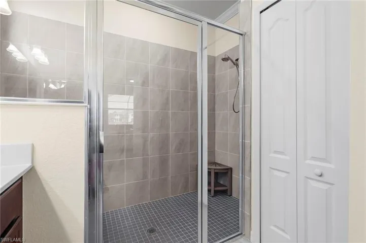 Bathroom with vanity and walk in shower