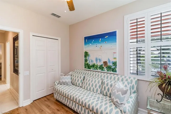3rd bedroom/den Sitting room featuring closet and wood-laminate flooring