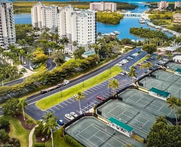 Tarpon Cove Yacht and Racquet Club optional membership featuring tennis, fitness club, tiki bar, resort-style pool and boat shuttle to beach.