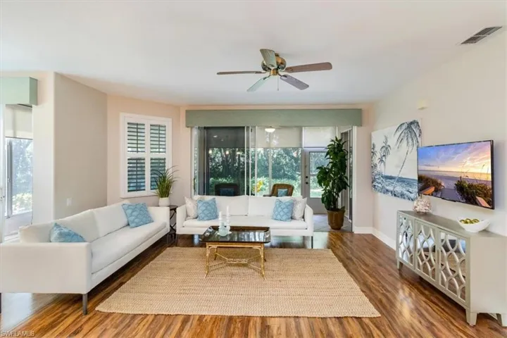 Living room great for entertaining many guests with 4 season lanai walk out.