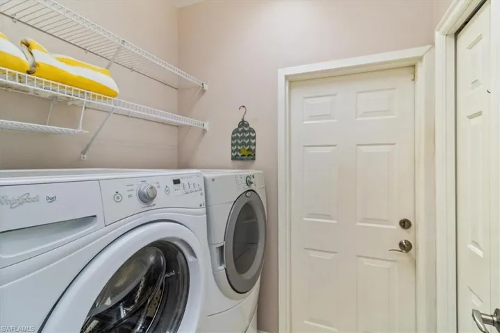 Laundry area with front load washer and dryer