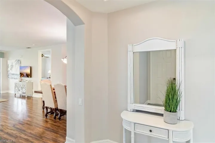 Hall with hardwood / wood-style flooring