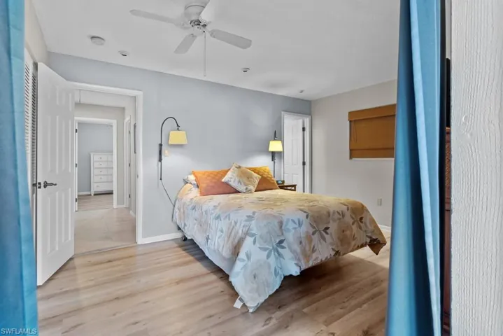 Bedroom featuring light wood-type flooring and ceiling fan