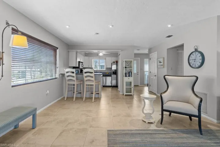 Tiled living room with ceiling fan