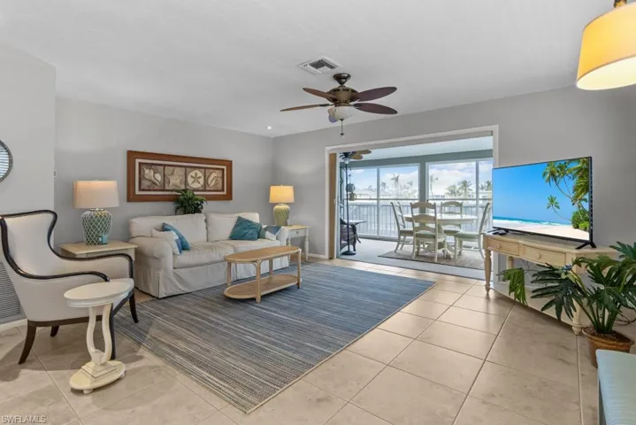 Tiled living room with ceiling fan
