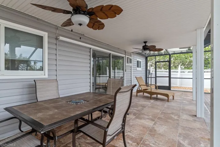 Sunroom featuring ceiling fan