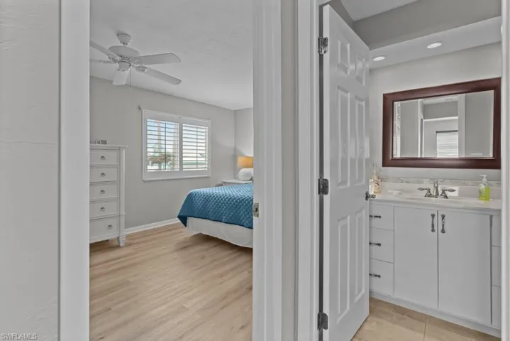 Bedroom with sink and ceiling fan