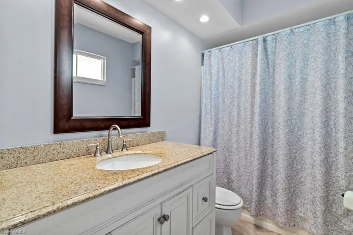 Bathroom featuring vanity and toilet