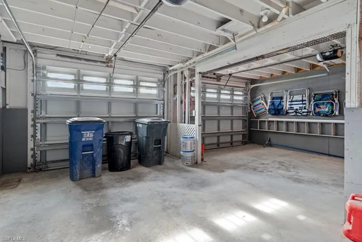Garage featuring a garage door opener