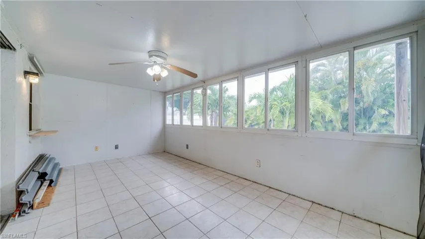 This Oversized Florida Room | Easily 2 Additional Living Areas
